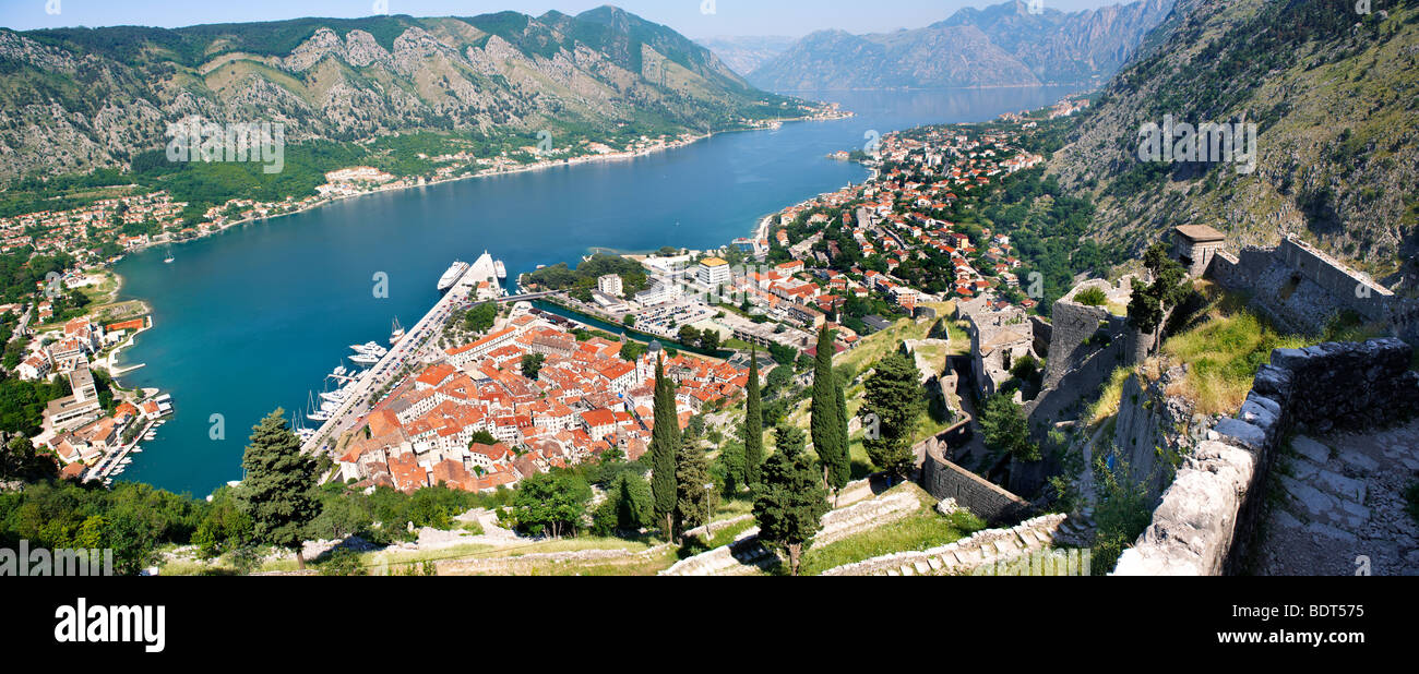 View from the medieval hill fortifications above Kotor across roof tops and Kotor Bay - Montenegro Stock Photo