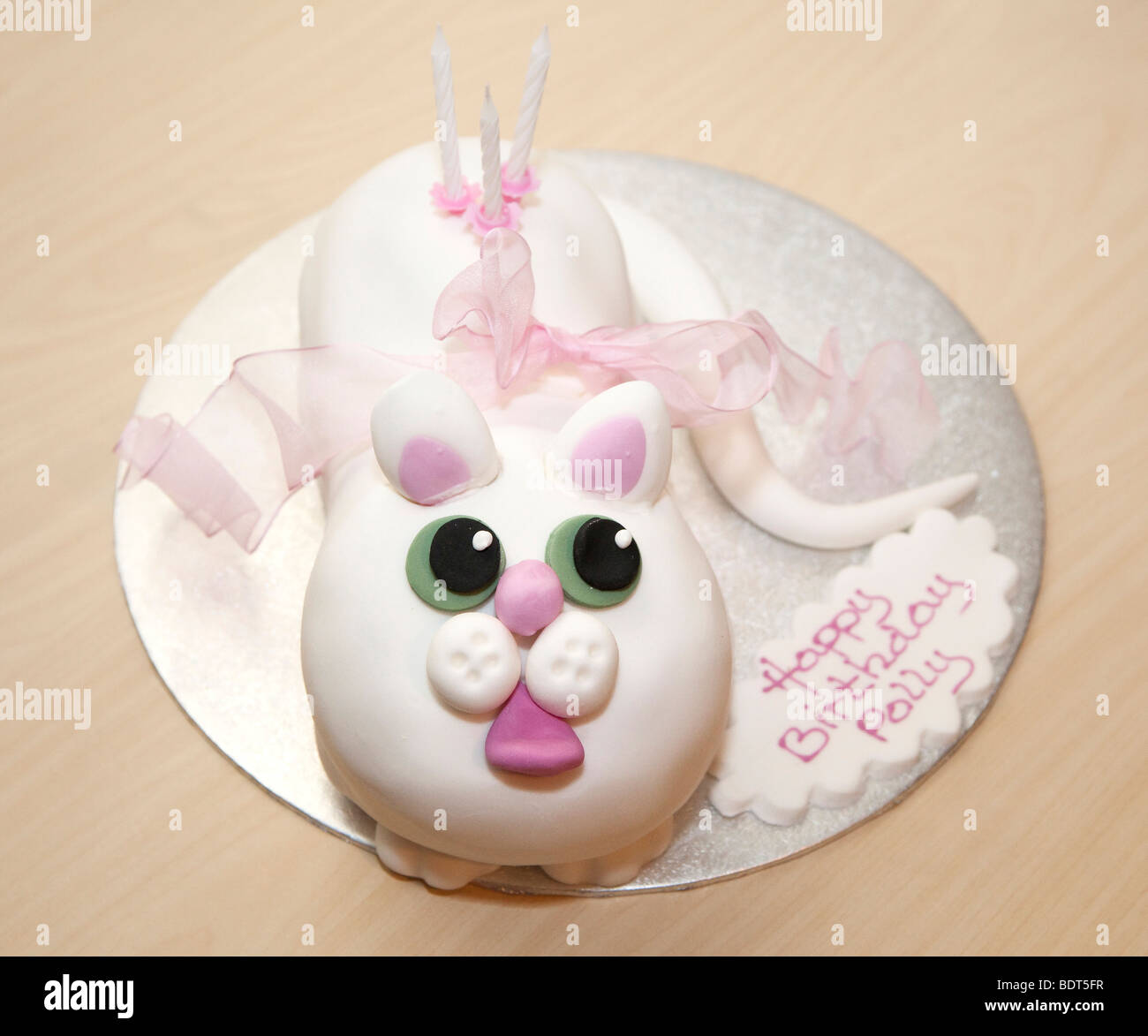 A white cat novelty birthday cake Stock Photo