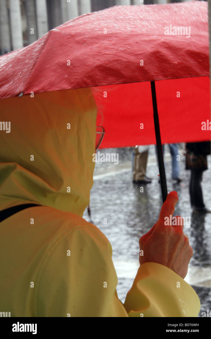 person with red umbrella in rain in city town Stock Photo Alamy