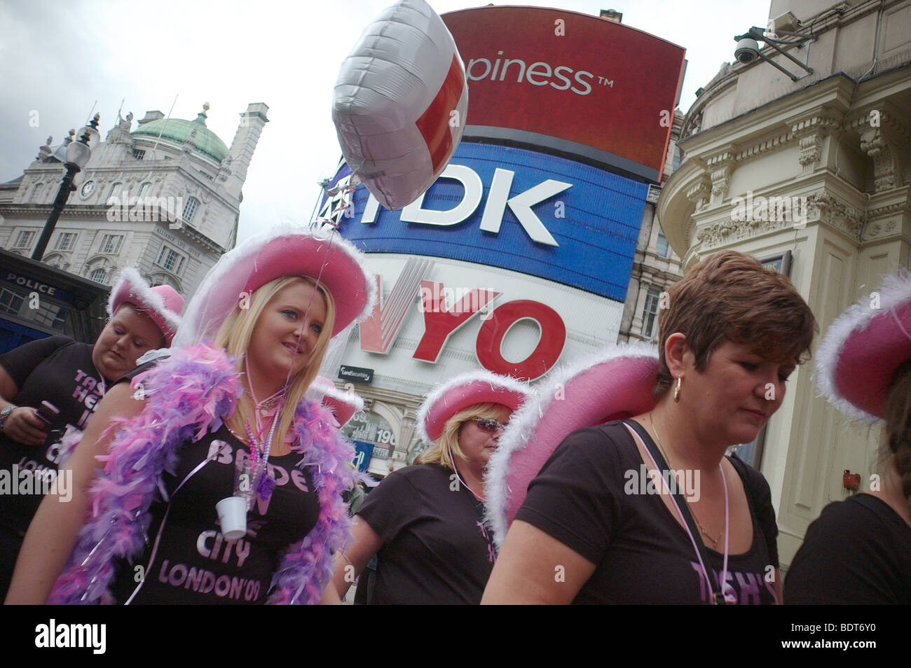 A hen party dressed in pink outfits Piccadily Circus London UK Stock Photo