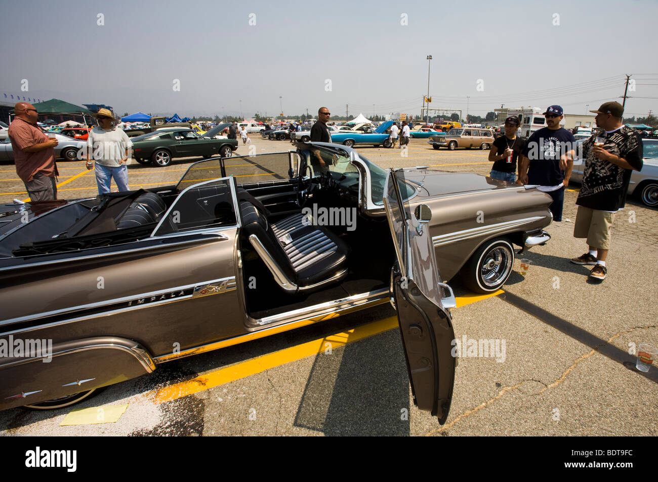 Admiring an Impala, Pomona Swap Meet for the antique auto enthusiast