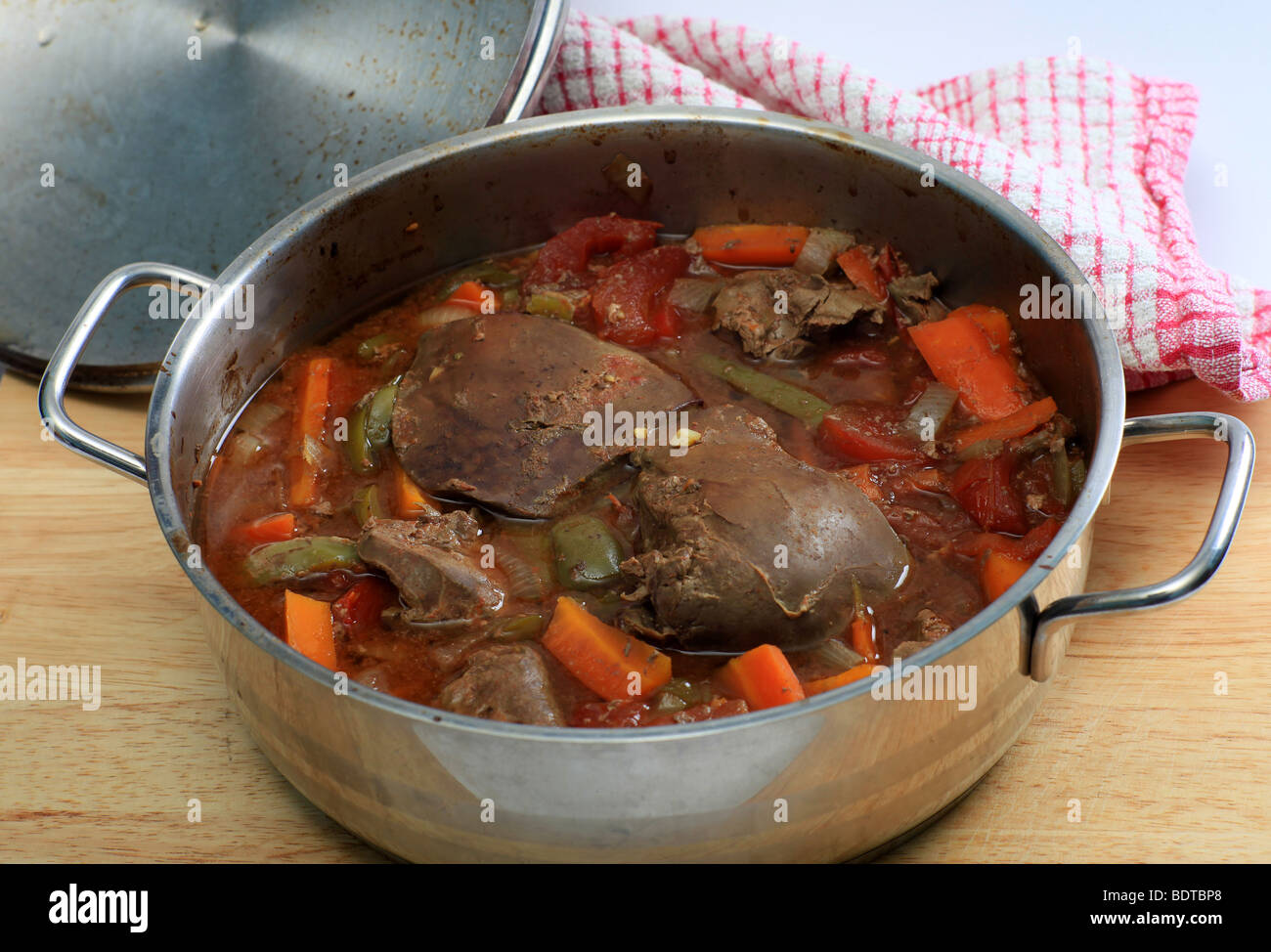 A lamb's liver and vegetable casserole straight from the oven Stock Photo