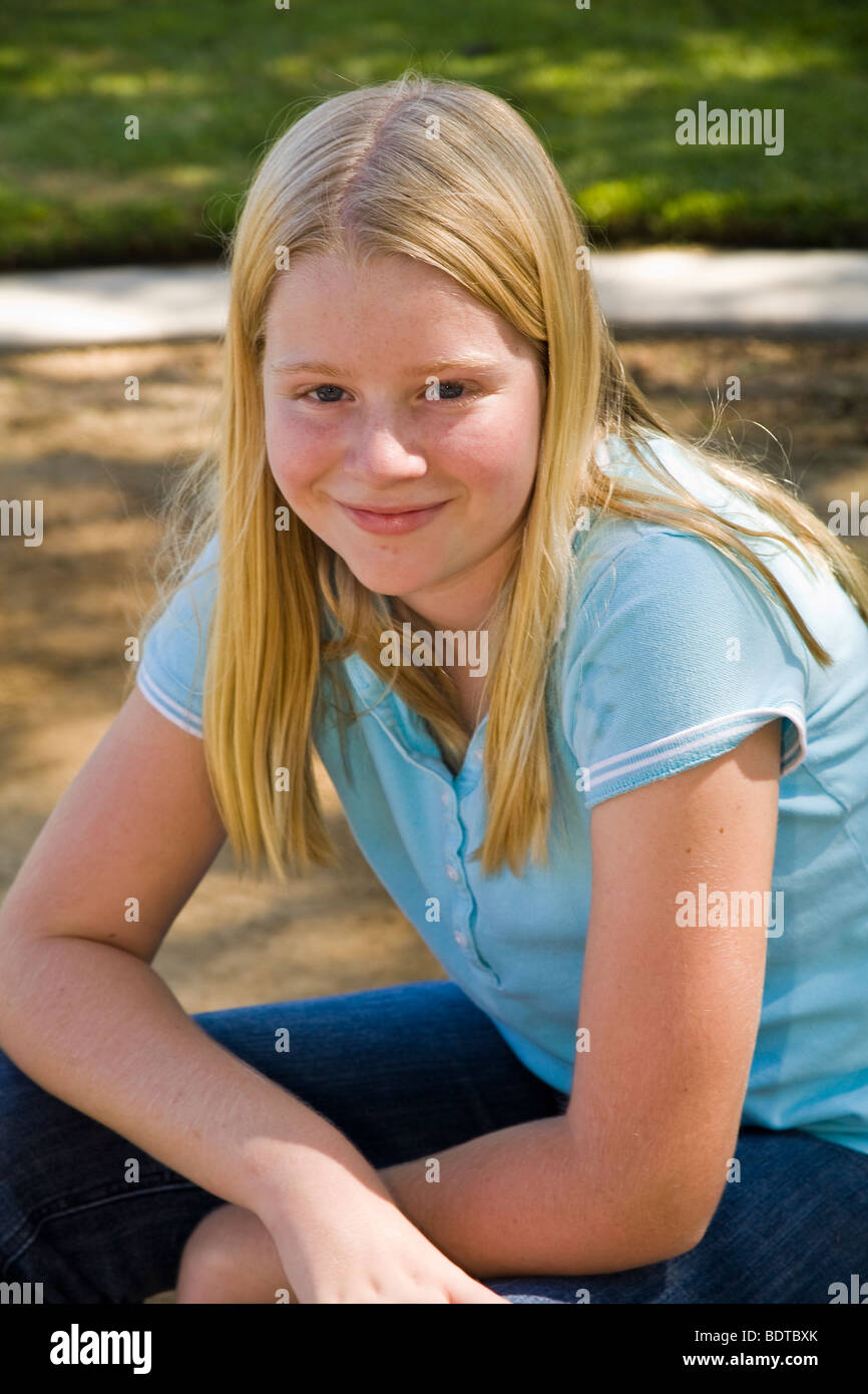 11 to 13 year old children young person people Teenage Junior high age Caucasian girl smiling camera.United States  MR  © Myrleen Pearson Stock Photo