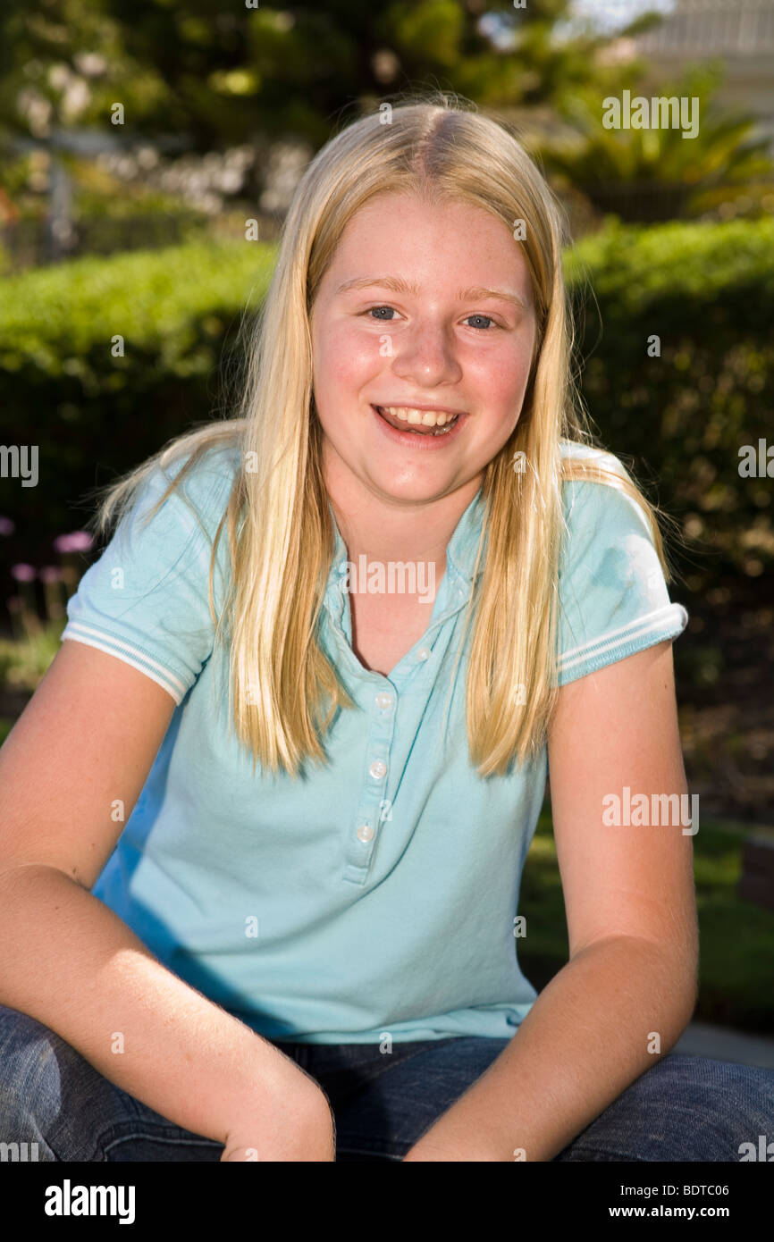 Caucasian 11-12 years old year olds children child smiling happily  Tween tweens young person people  camera United States .MR  © Myrleen Pearson Stock Photo