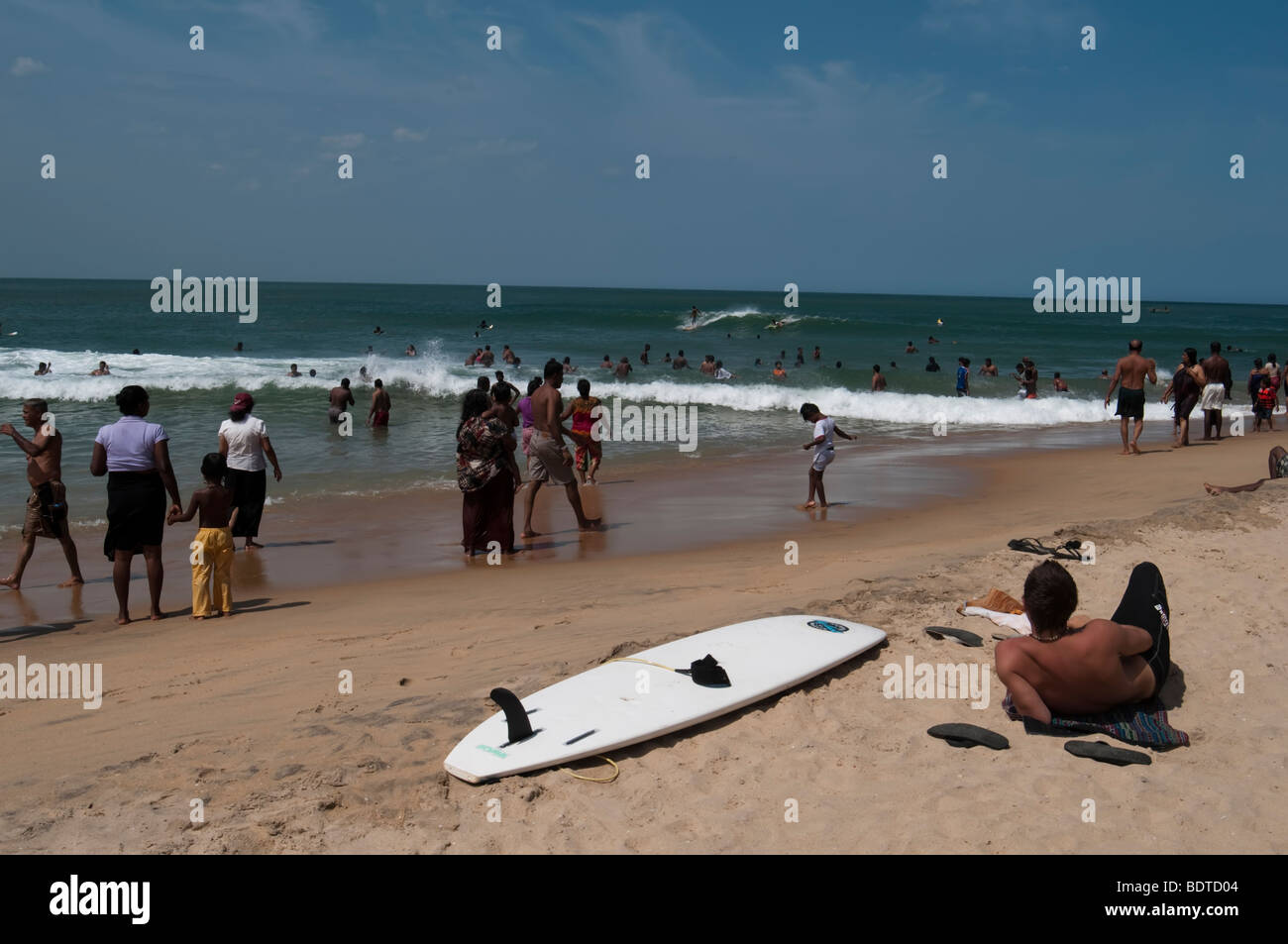 Arugam Bay  Sri Lanka busy beach local Asian Indian Ocean sand sea people east coast surfer  surfers holiday travel surf board Stock Photo