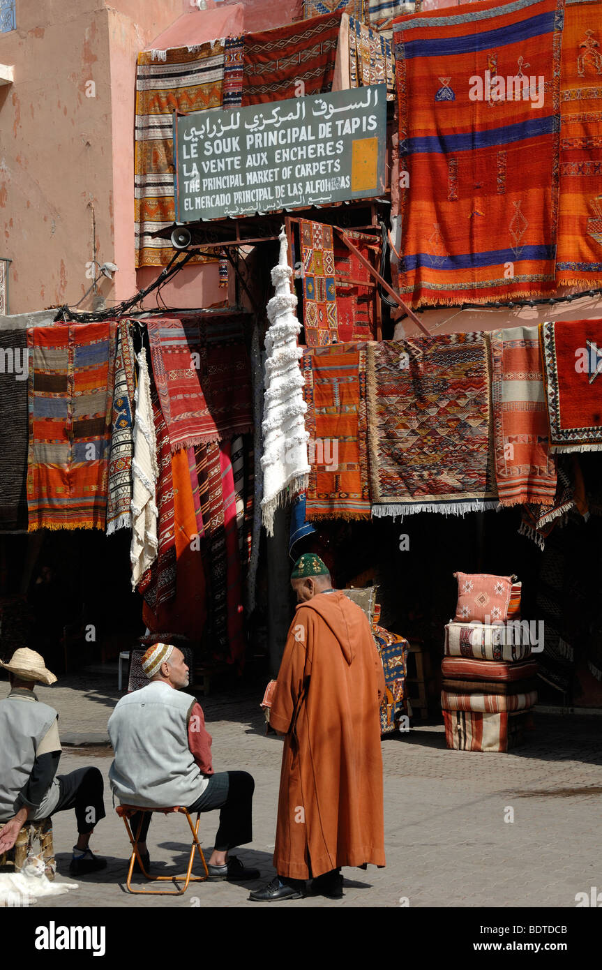 Moroccan Men in the Carpet Bazaar, Market or Souk, Place aux Epices, Marrakesh Morocco Stock Photo