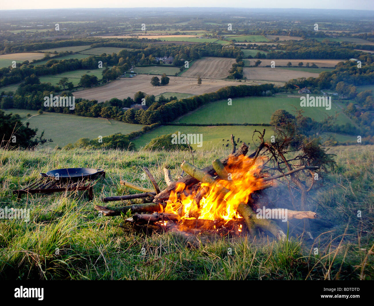 Preparing a campfire for cooking on a camping trip Stock Photo
