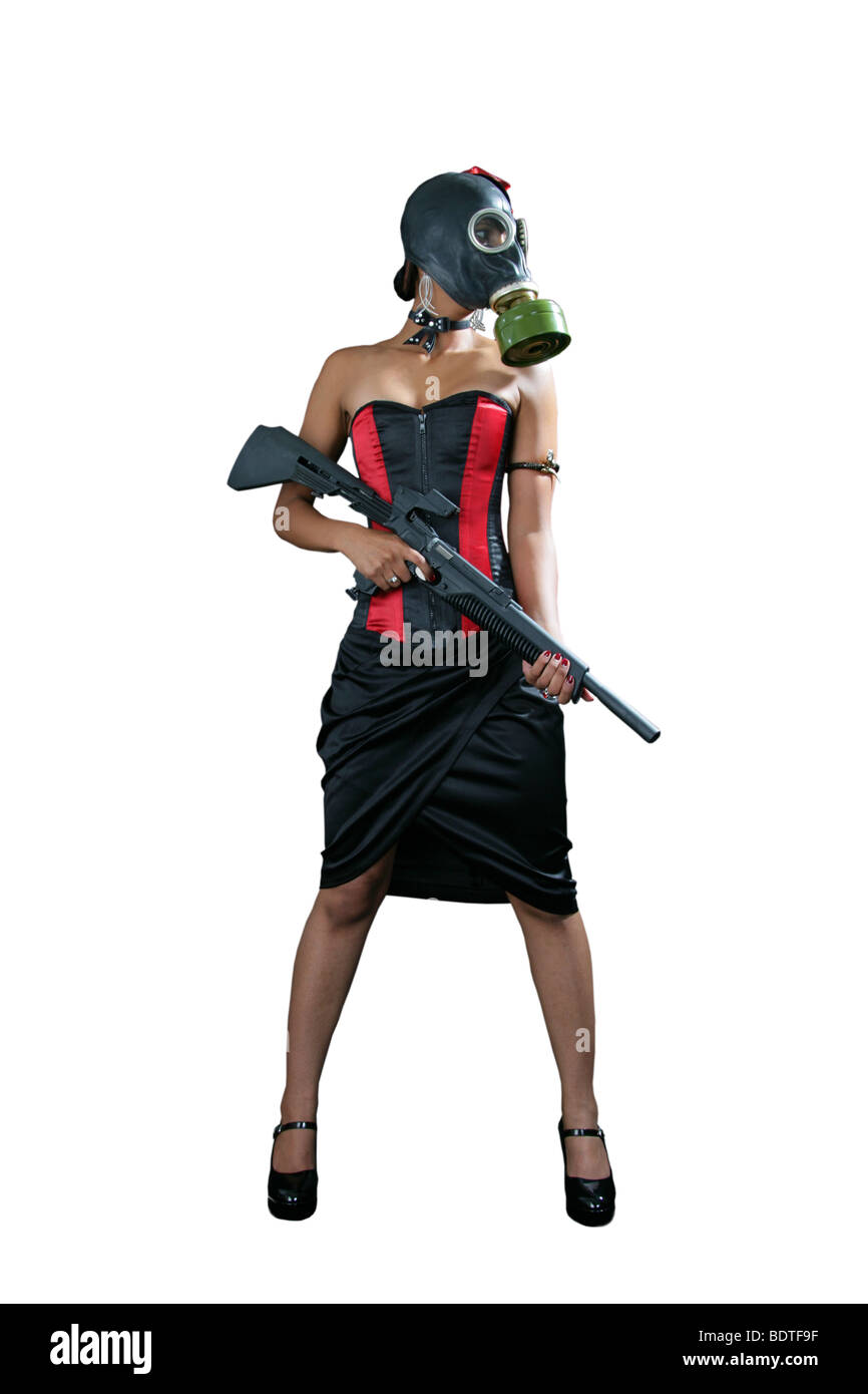 Sexy Burlesque Girl Wearing a Black and Red Corset and Gas Mask and Brandishing a Rifle Stock Photo