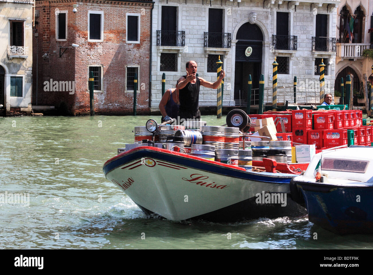 Beverage delivery by cargo boat in Venice, Italy Stock Photo