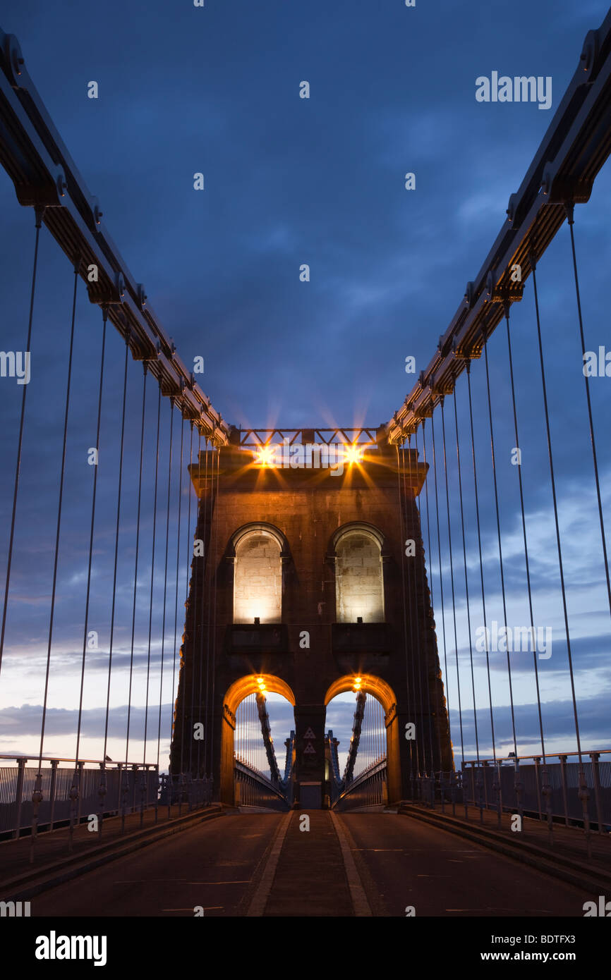 Bangor, Gwynedd, North Wales, UK, Europe. View along the A5 road across the Menai suspension bridge to Anglesey at night Stock Photo