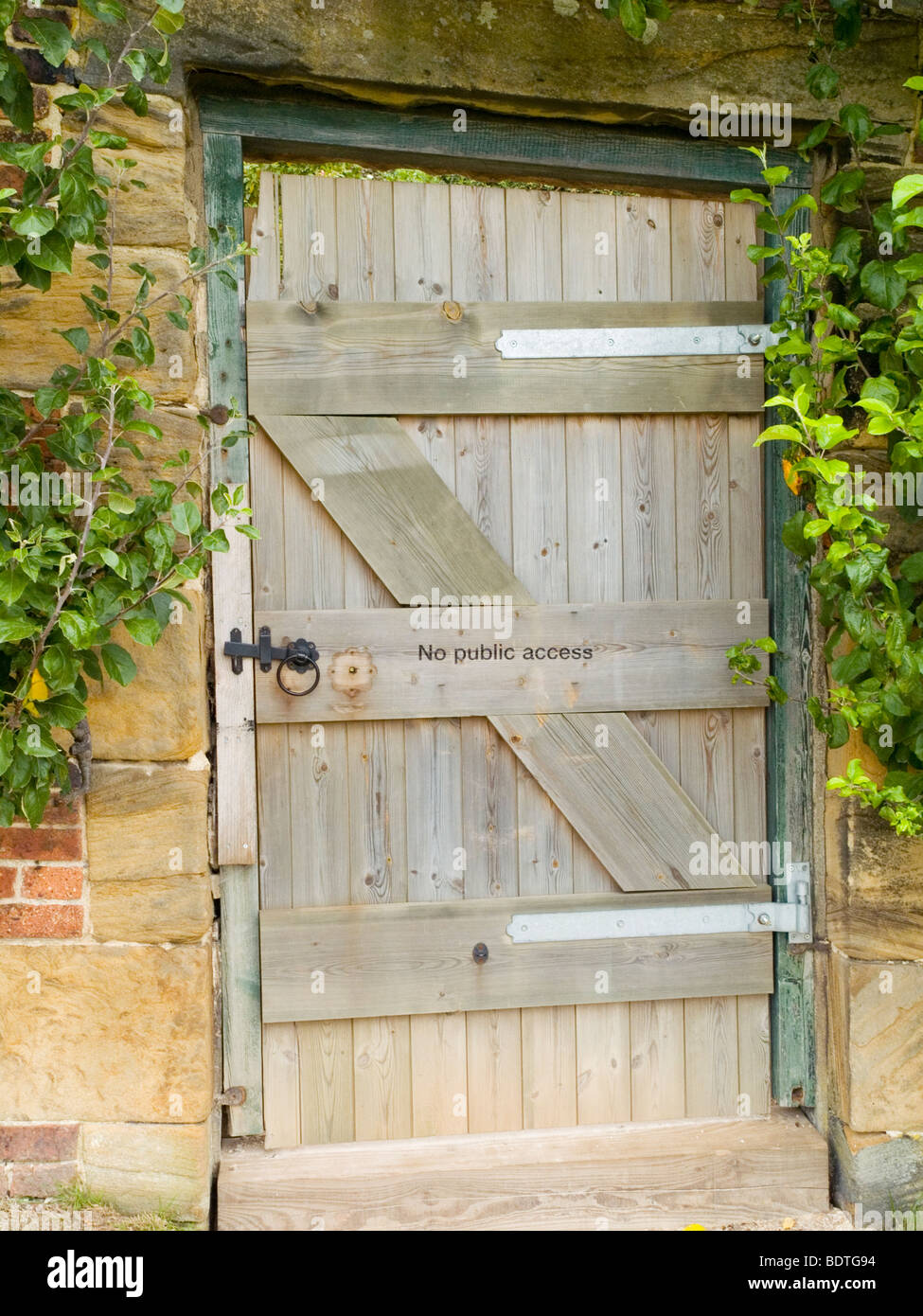 A wooden door in a wall at the Yorkshire Sculpture Park, West Bretton