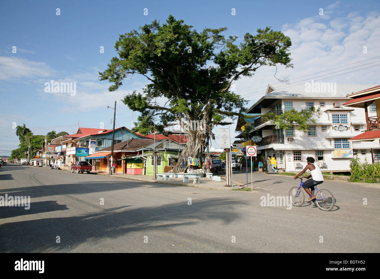 panama, bocas del toro, bocas town main street biker along traditional