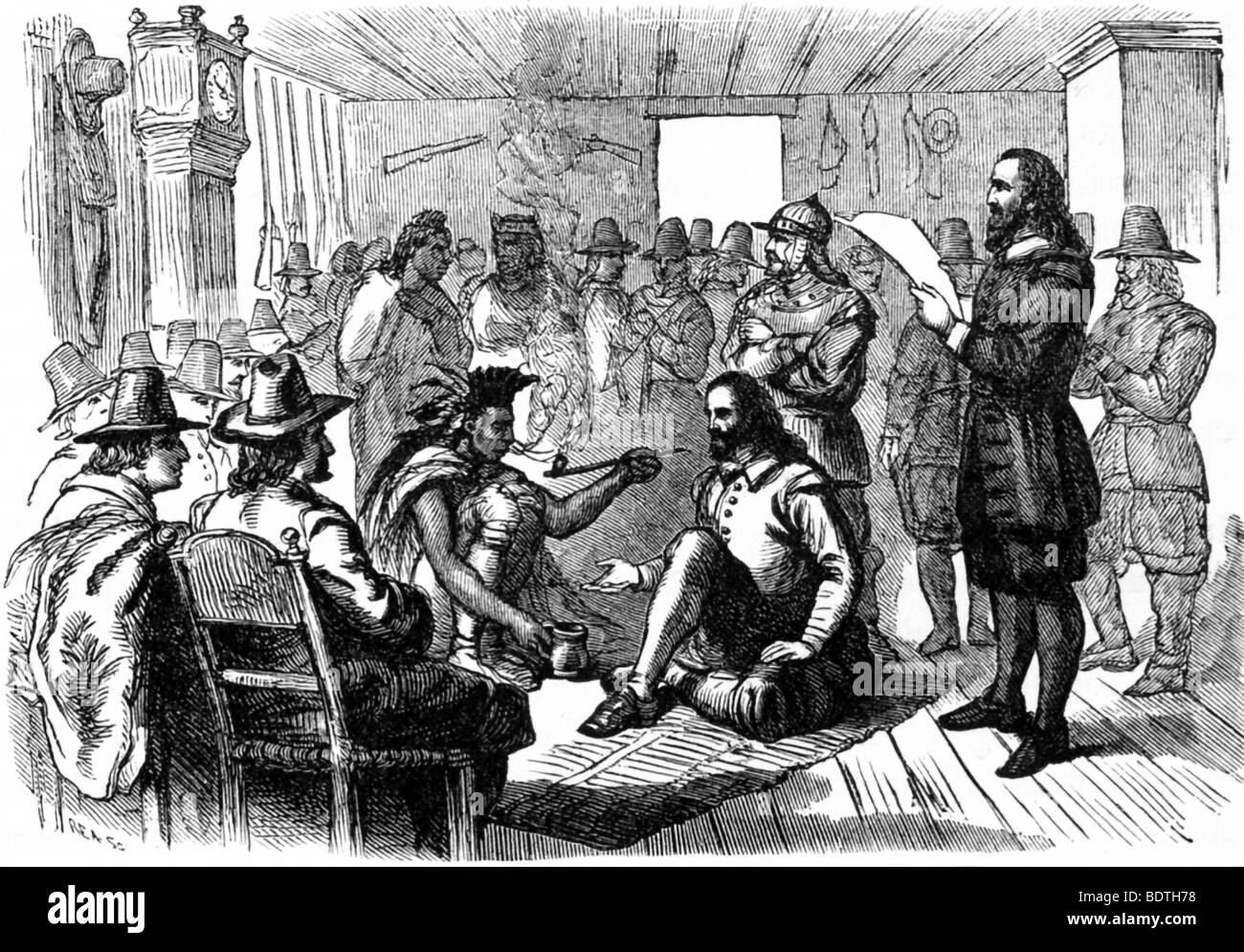 In 1621, Captain Standish and William Brewster came to a formal agreement with Massasoit in a house being built in Plymouth. Stock Photo