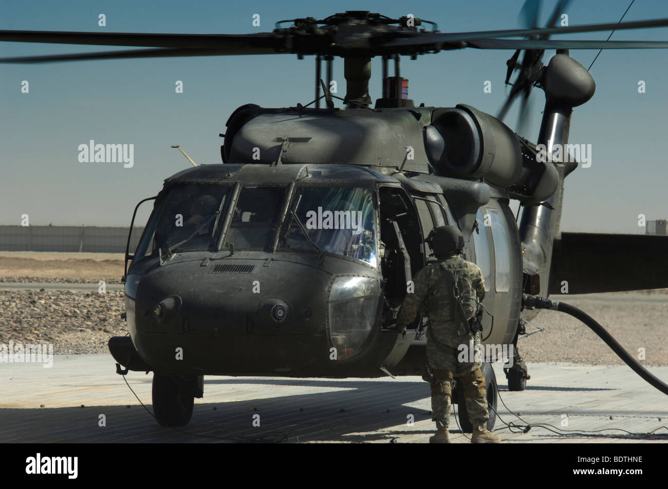 US Army Blackhawk helicopter refuelling in Southern Afghanistan Stock Photo