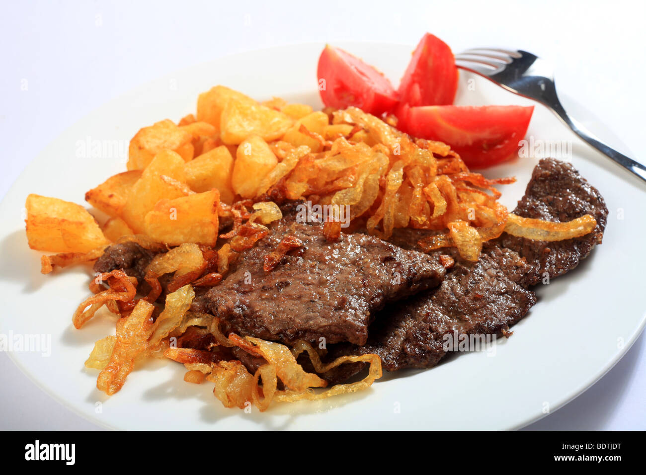 Traditional Austrian zweibelrostbraten, beef escalope with crispy fried