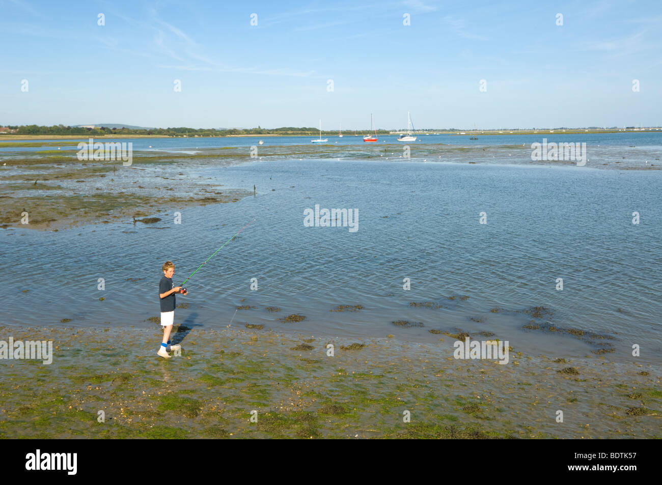 Boy fishing Hayling Island West Sussex UK Stock Photo Alamy