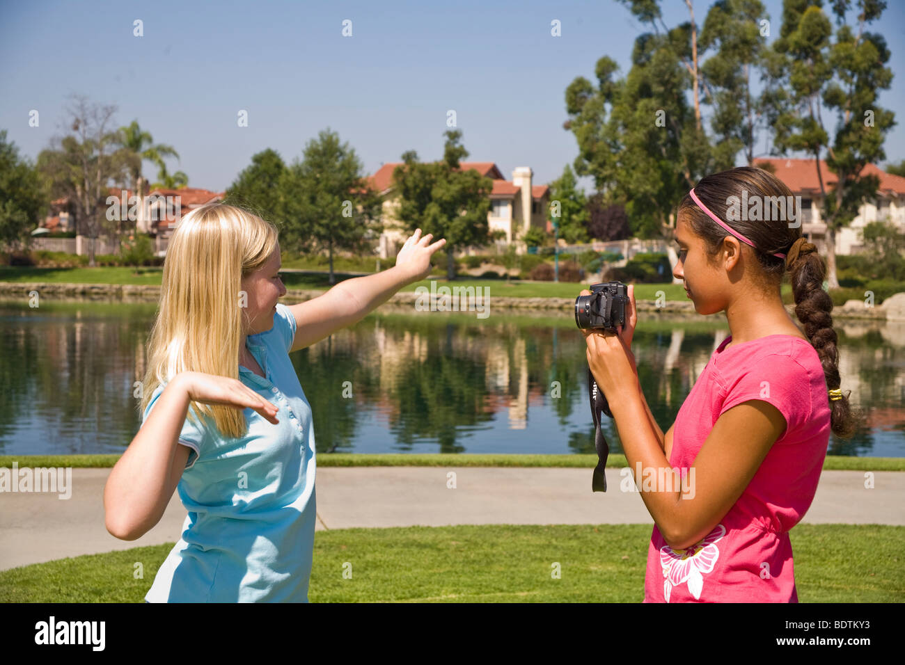 United States Two Racially mixed mix Ethnic diversity girls hang hanging out together.Hispanic junior high girl photo taking pictures Caucasian friend Stock Photo