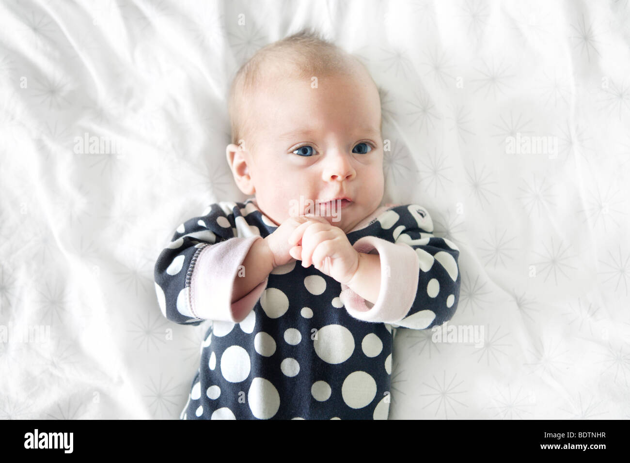 A baby on a bed Stock Photo Alamy