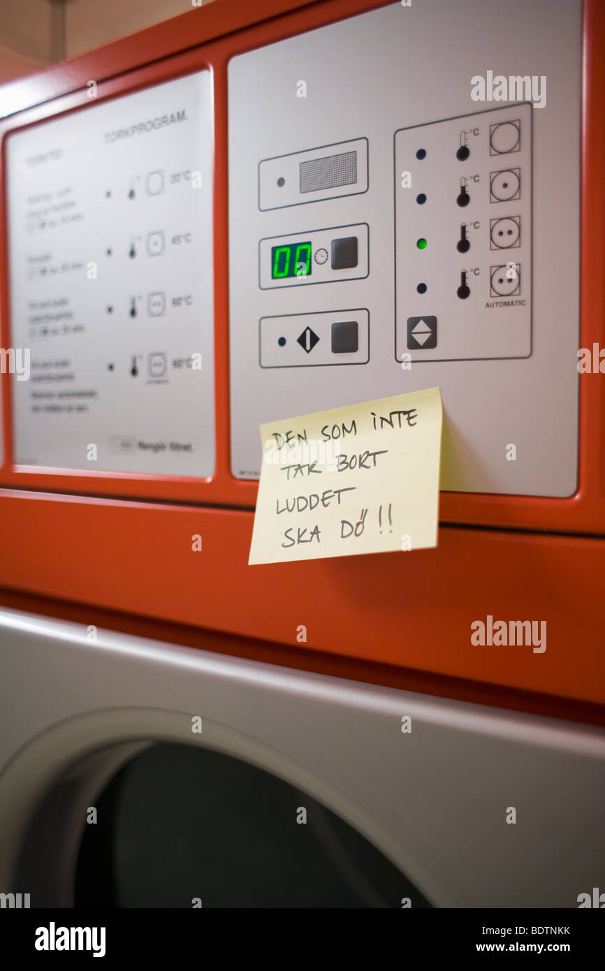 A handwritten message on a washing machine Stock Photo