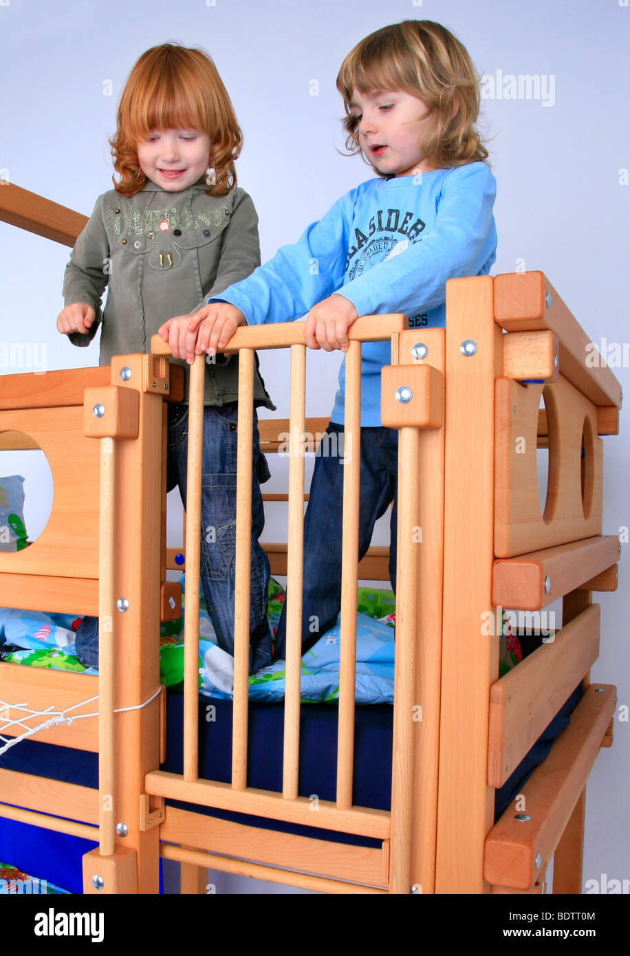 children playing in a Billi-Bolli loft bed, closing the entry Stock Photo