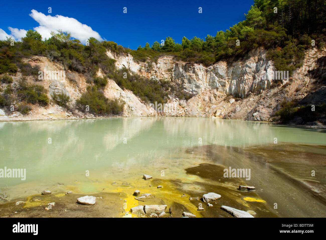 Hot Pools, greenish pool with yellow sulphurous streaks on unstable ground, Waiotapu Thermal Wonderland, Rotorua, New Zealand Stock Photo