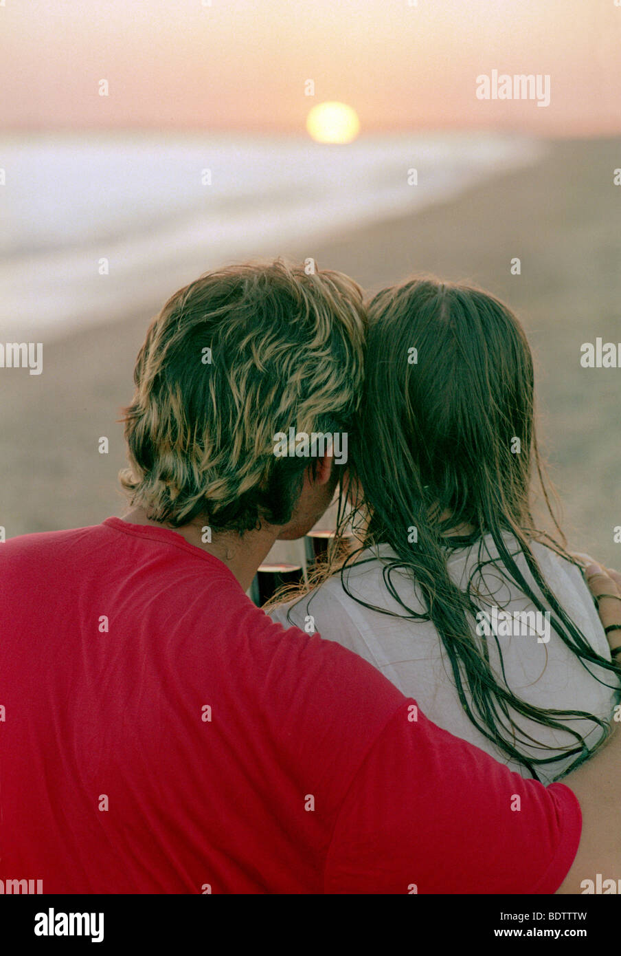 romantic couple with goblet of red wine on a beach Stock Photo - Alamy