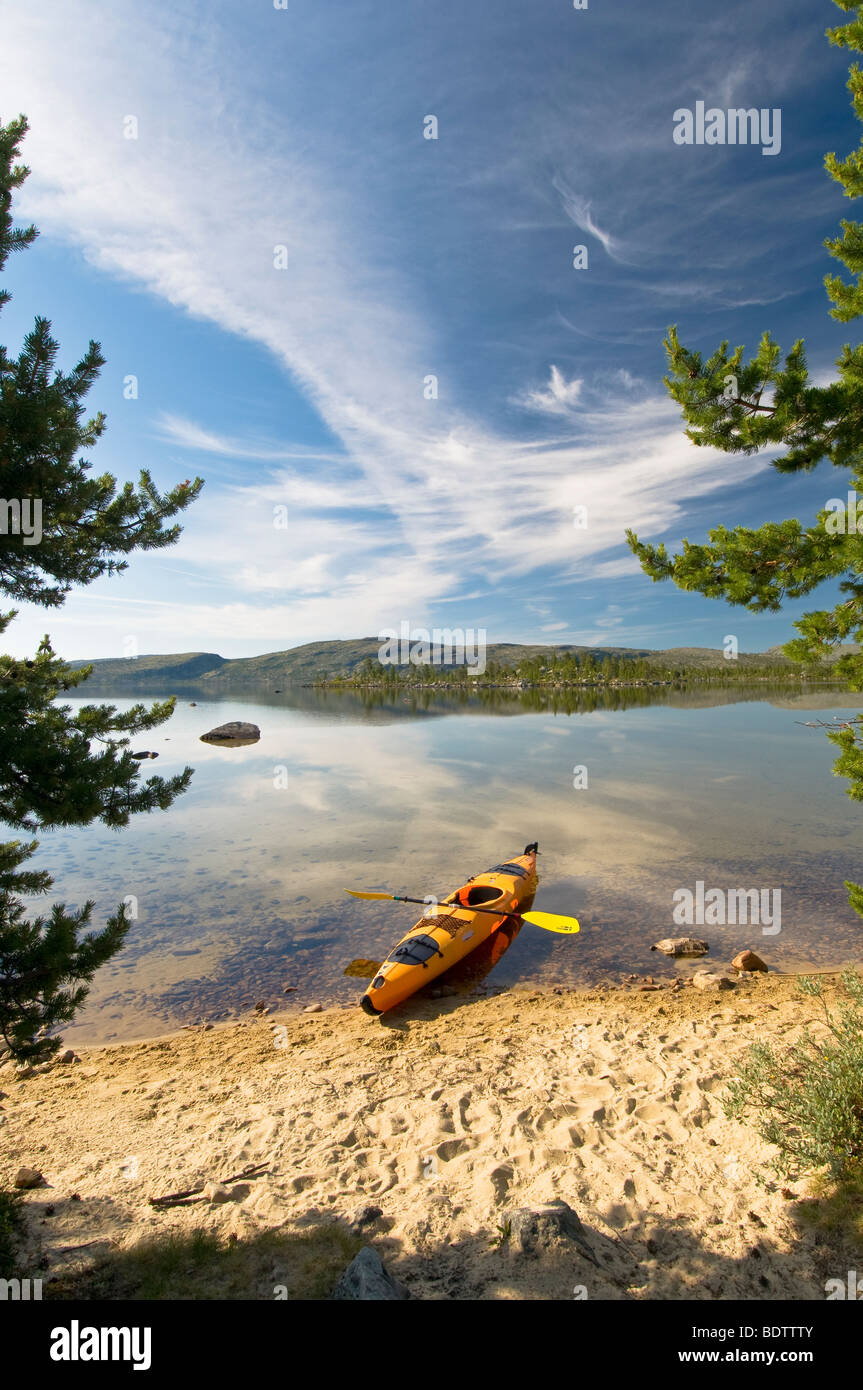 kayak at sandy beach of lake rogen, nature reserve, sweden Stock Photo