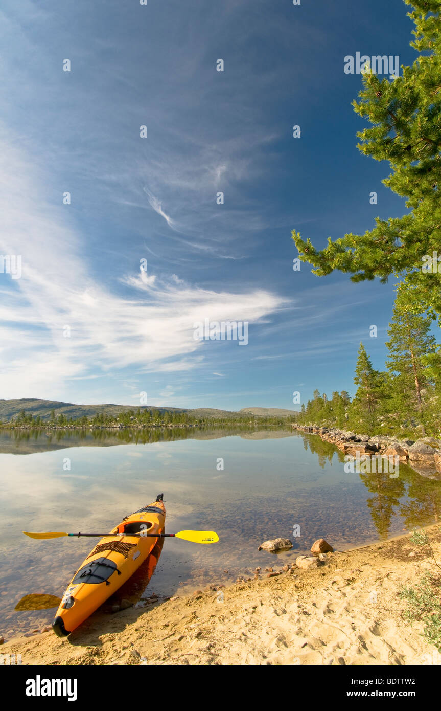 kayak at sandy beach of lake rogen, nature reserve, sweden Stock Photo
