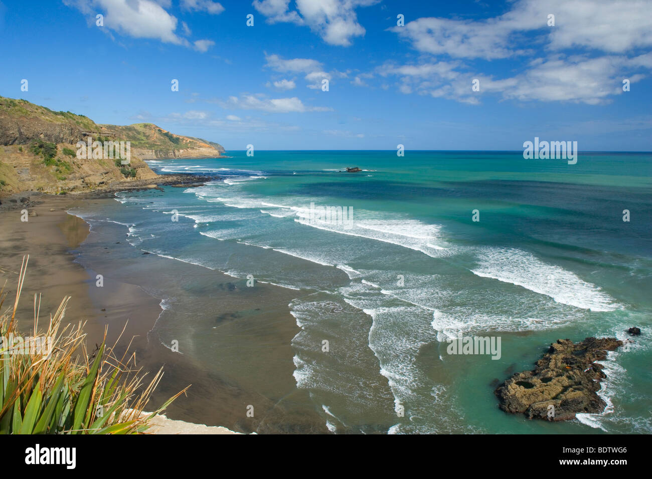 Maori Bay, waves rolling ashore the black sand beach of Maori Bay, Muriwai Regional Park, Auckland, North Island, New Zealand Stock Photo
