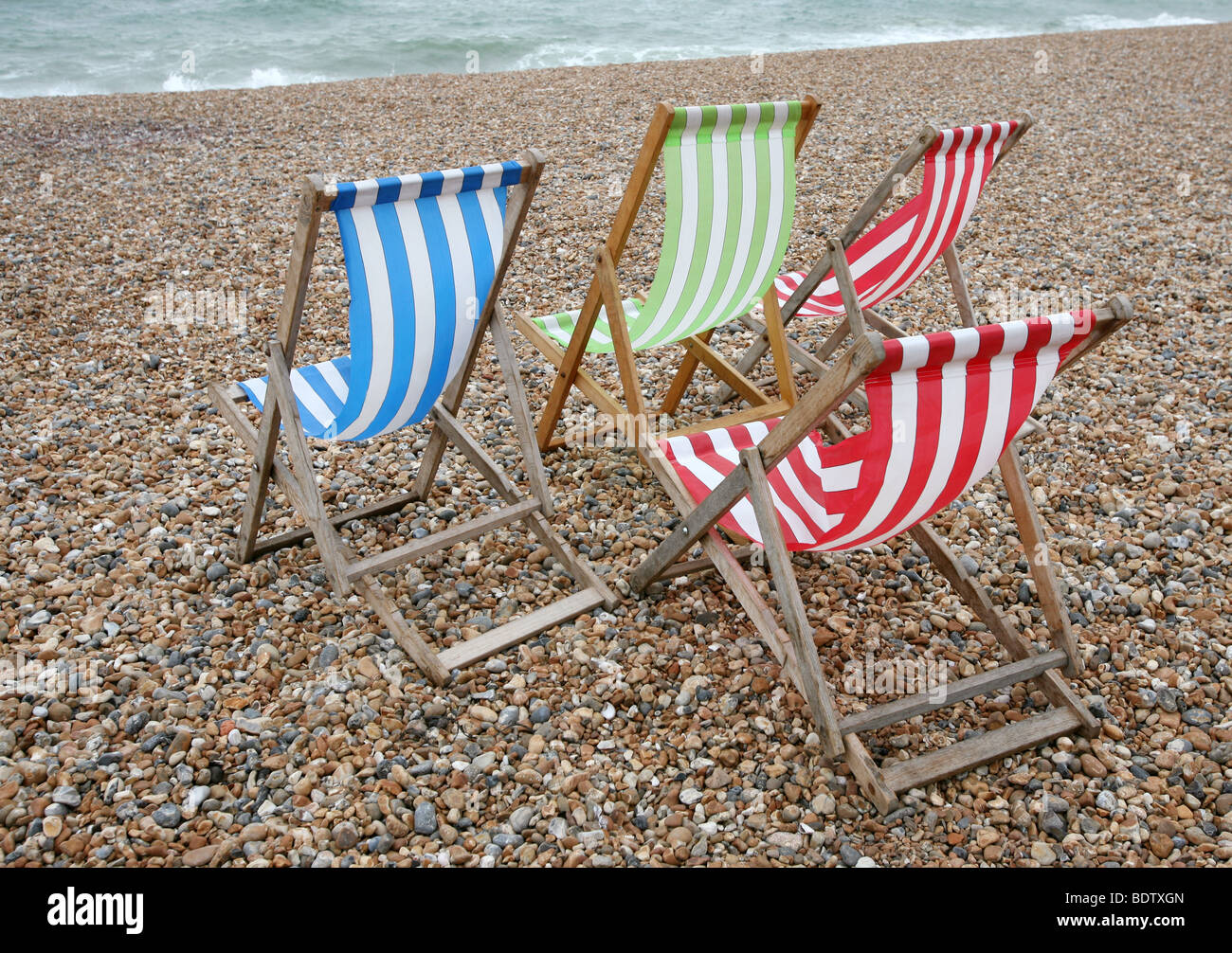 Colourful striped deckchairs on Brighton beach Stock Photo Alamy