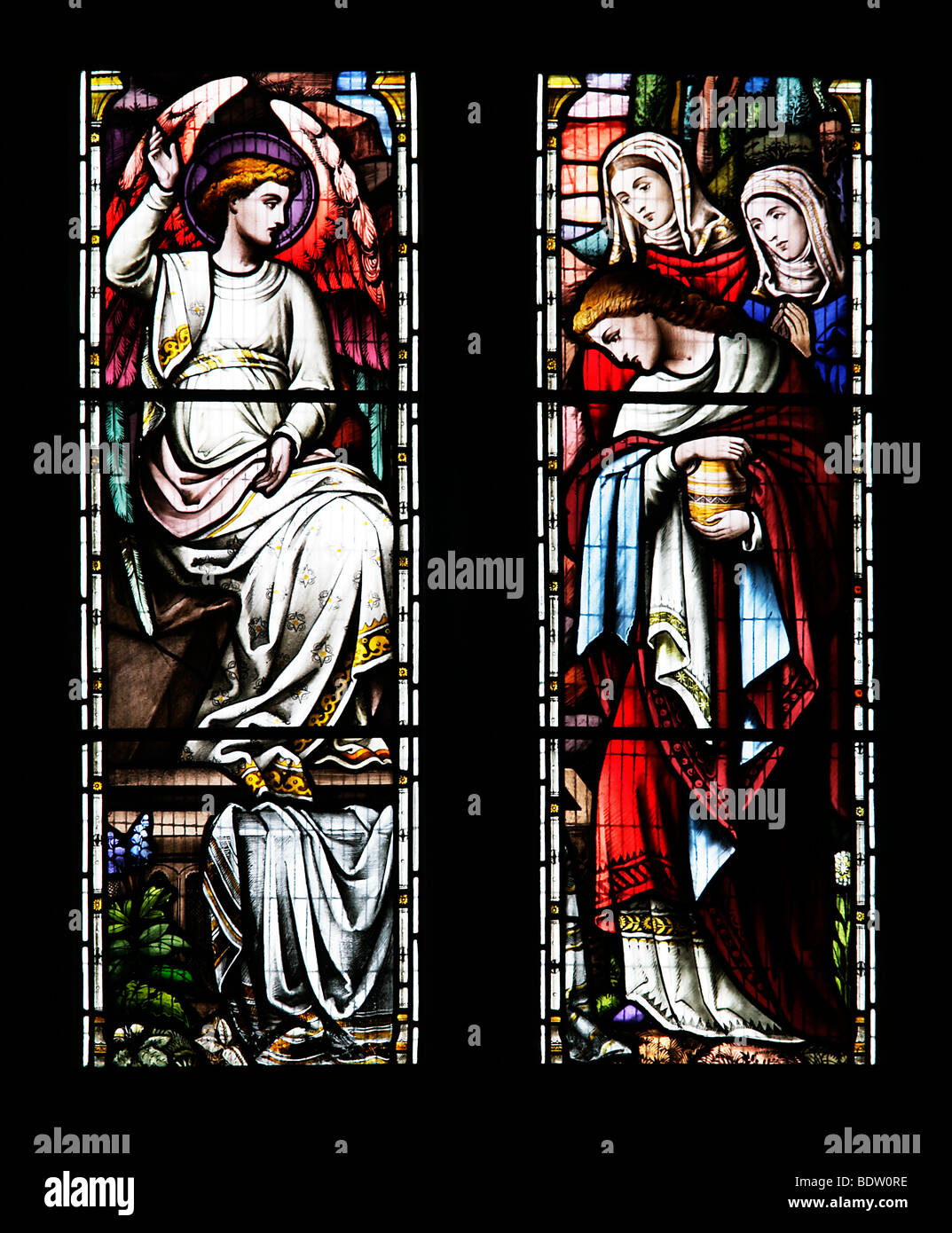 Stained glass window depicting The Angel Appearing tothe Three Maries at the empty tomb, St Tudy church, Cornwall Stock Photo