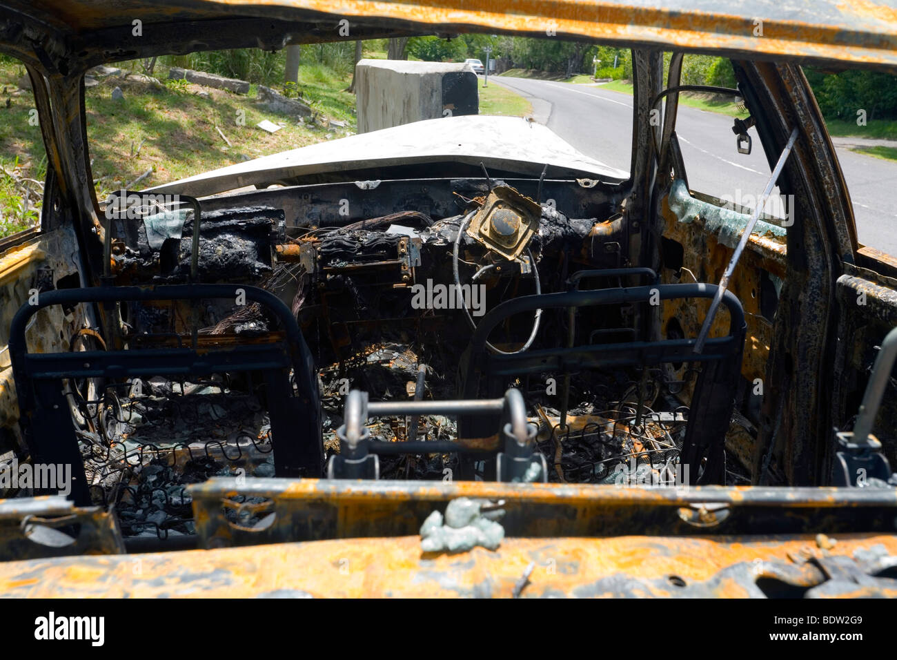 Remains of a car after crash and fire. Stock Photo