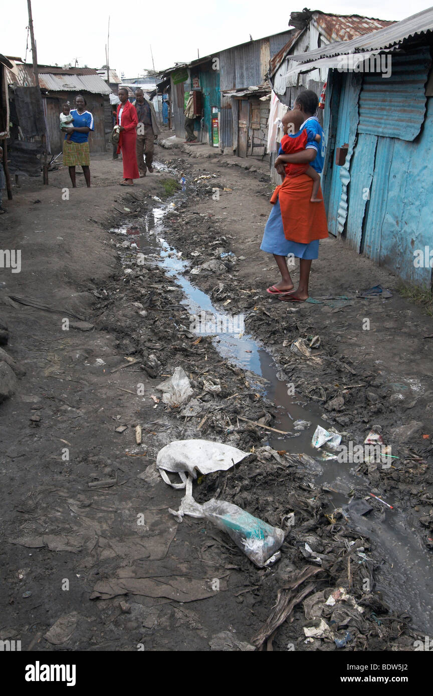KENYA Open drain filled with garbage in a street of Mukuru Ruben, a slum of Nairobi. Photo by Sean Sprague 2007 Stock Photo
