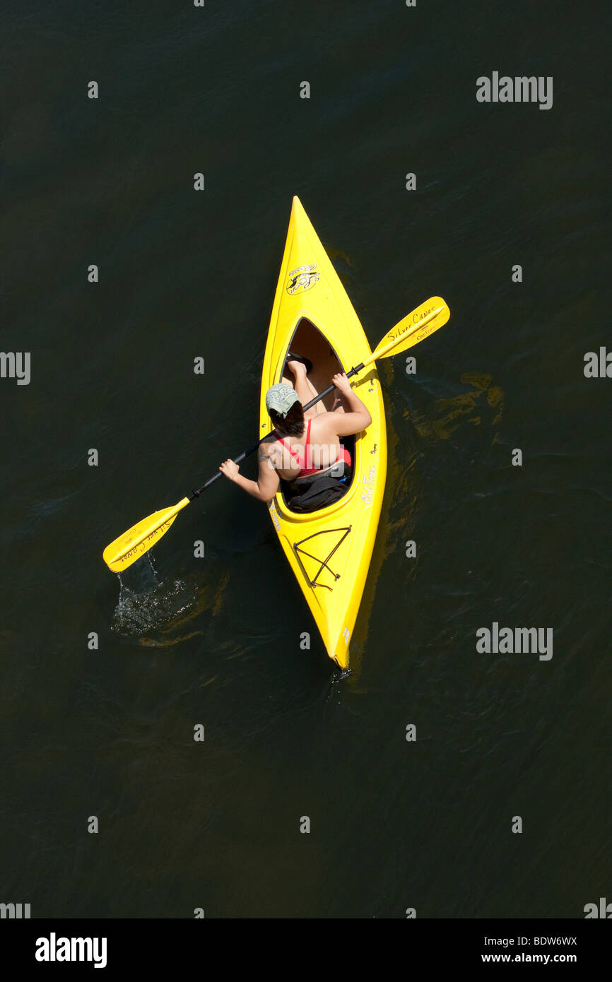 A young man in a yellow kayak. Drifting down the Delaware River, shot from a above. Stock Photo