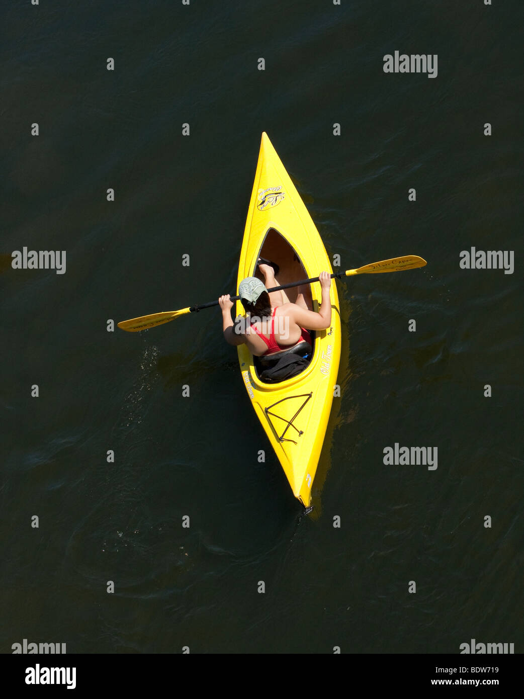A young man in a yellow kayak. Drifting down the Delaware River, shot from a above. Stock Photo