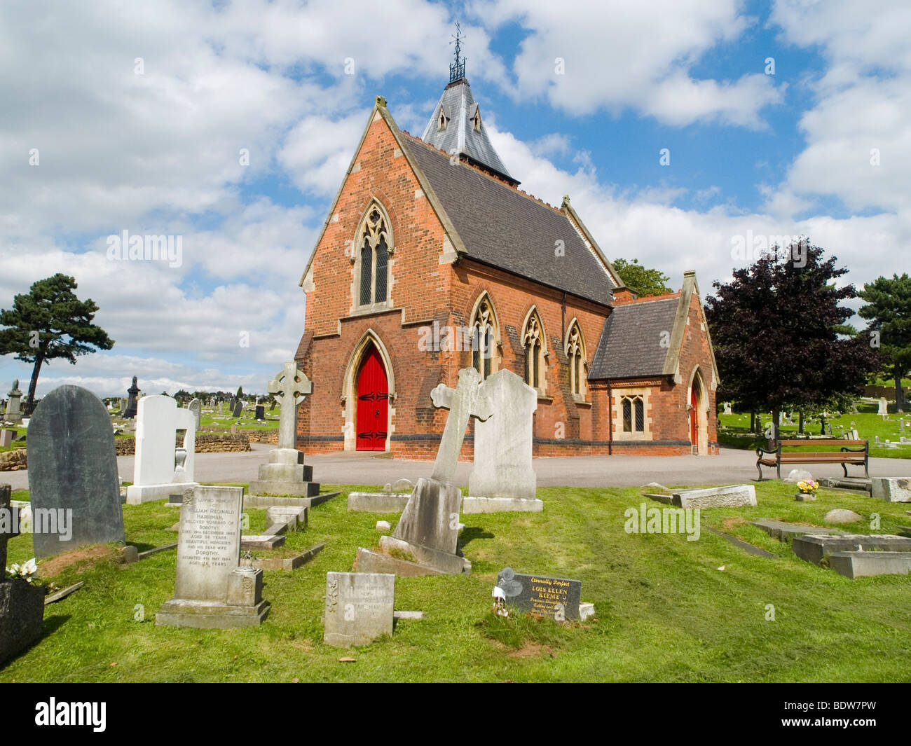 A chapel surrounded by gravestones in a cemetery in Carlton, Nottingham England UK Stock Photo