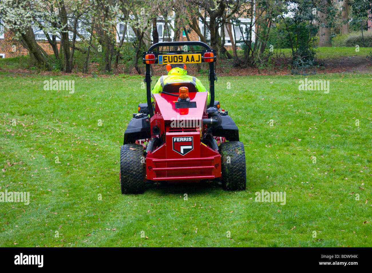 Islington council lawnmower at work on council estate in North London England UK. Stock Photo
