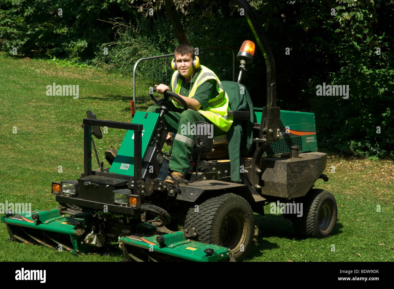 Islington council lawnmower at work on council estate in North London England UK. Stock Photo