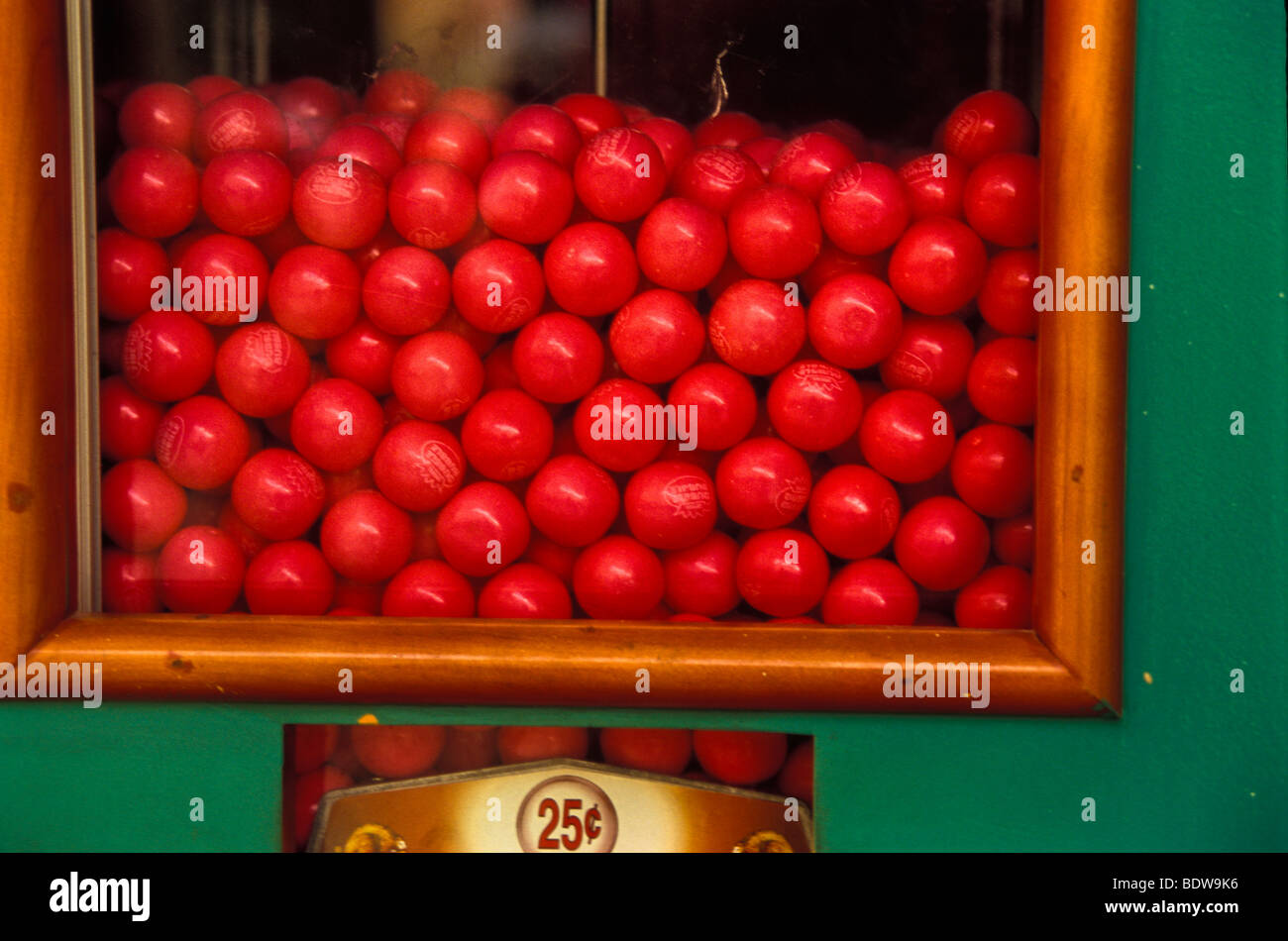 Colorful gum ball machine 25c red pink green, in shopping mall Stock Photo