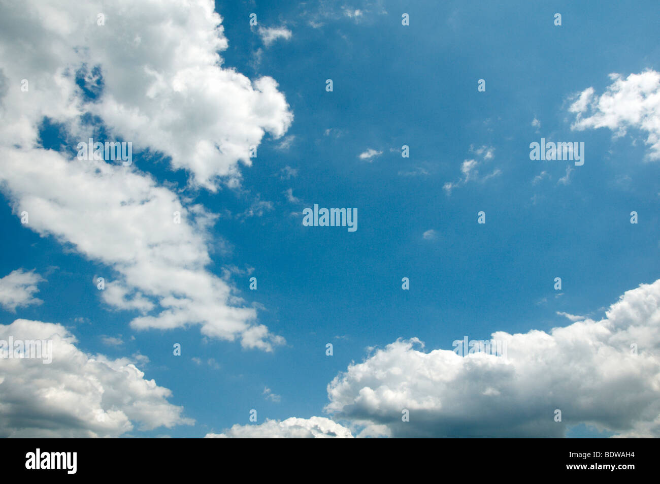 Blue sky and fluffy white clouds Stock Photo - Alamy