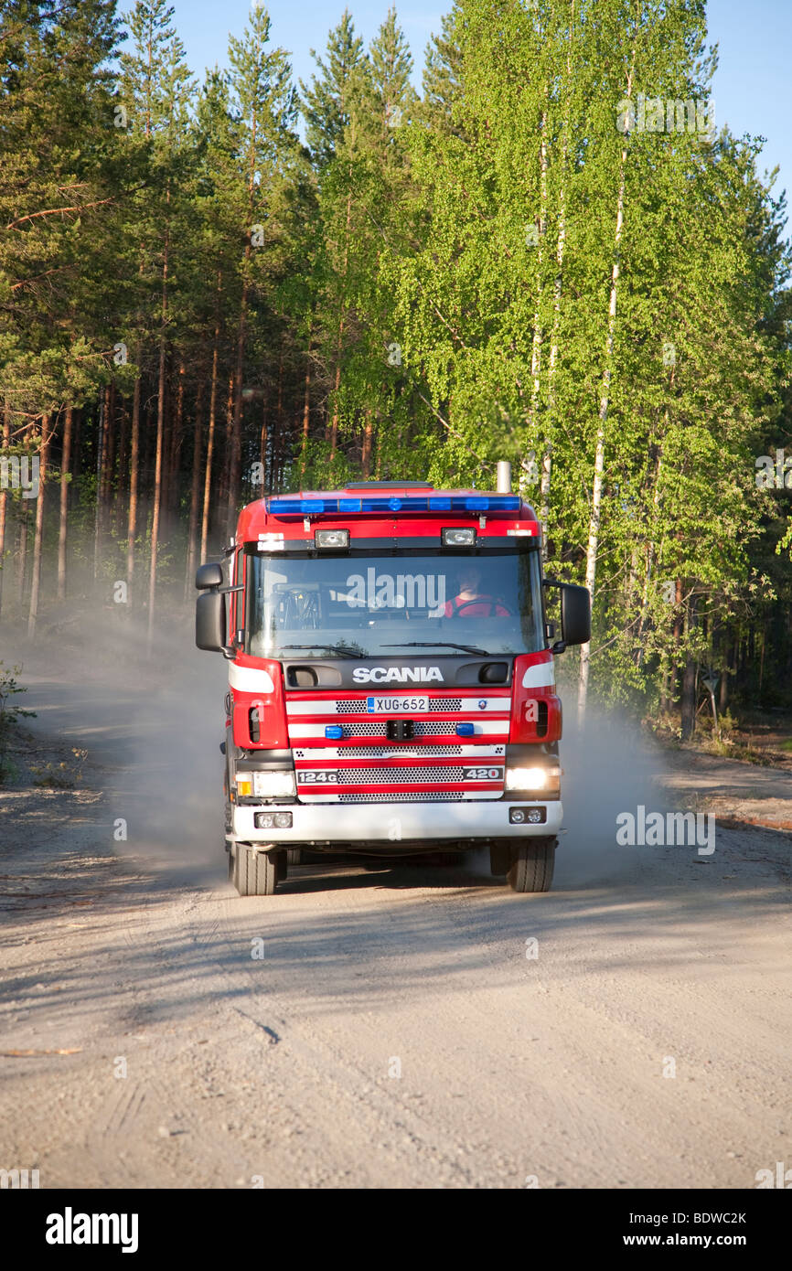 Finnish fire truck at forest road , Finland Stock Photo