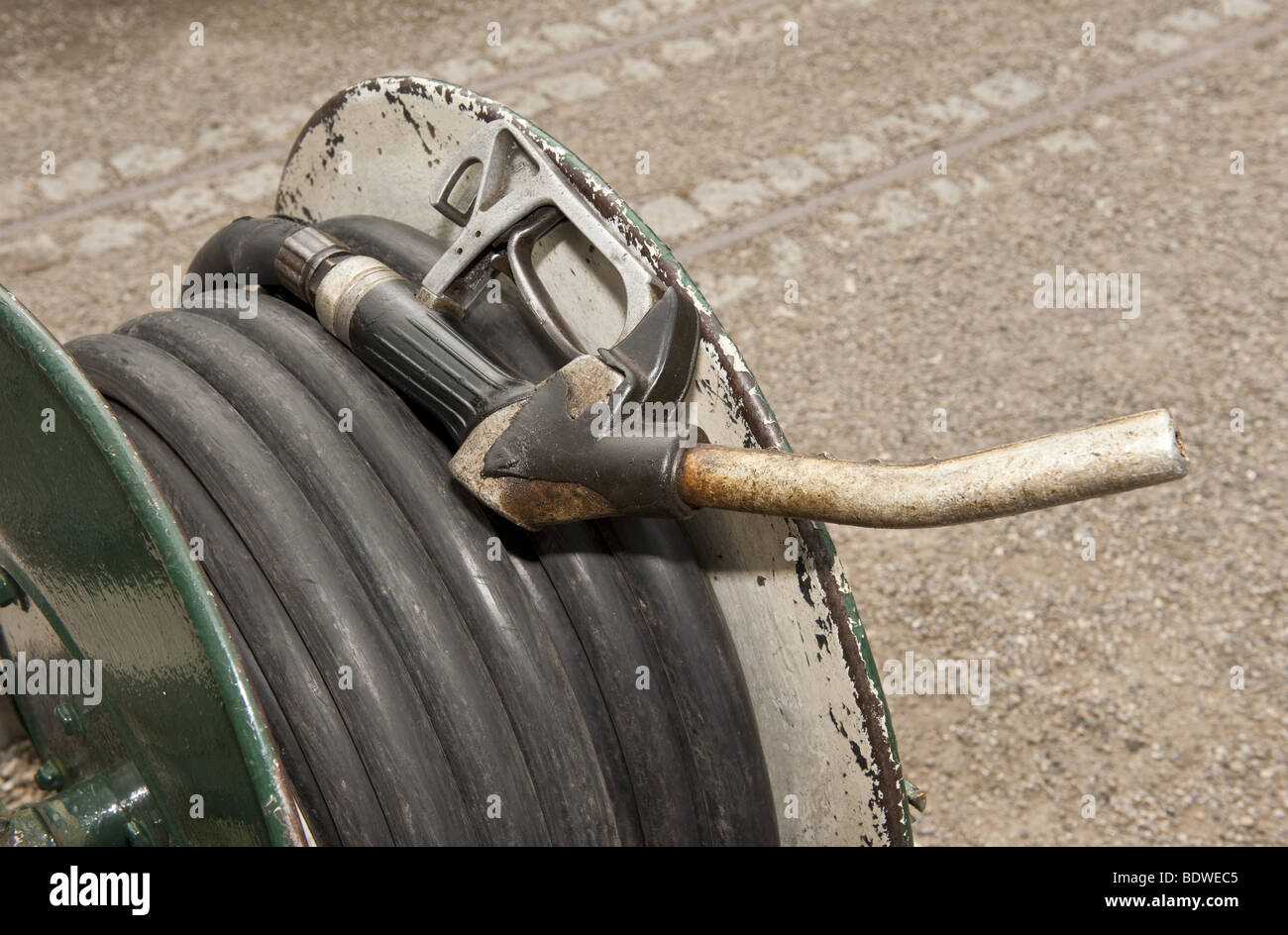 Close up of fuel pump nozzle handle and reel with coiled extendible hose  used for refueling canal narrow boats at wharf Stock Photo - Alamy