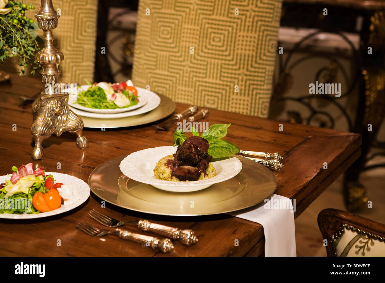 A luxurious place setting with food served Stock Photo