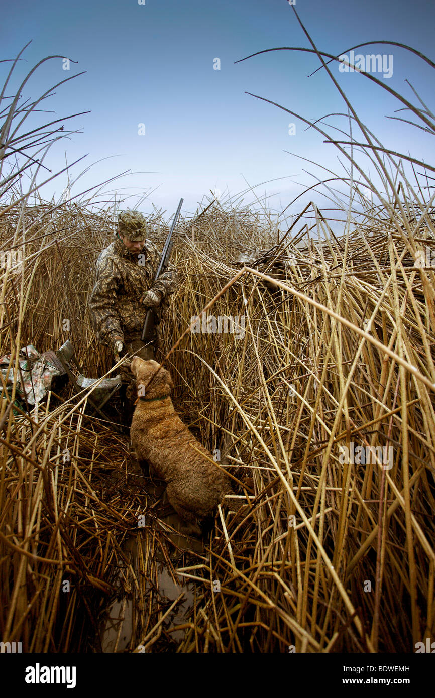 A man and his dog prepare to duck hunt in the Snake River Canyon