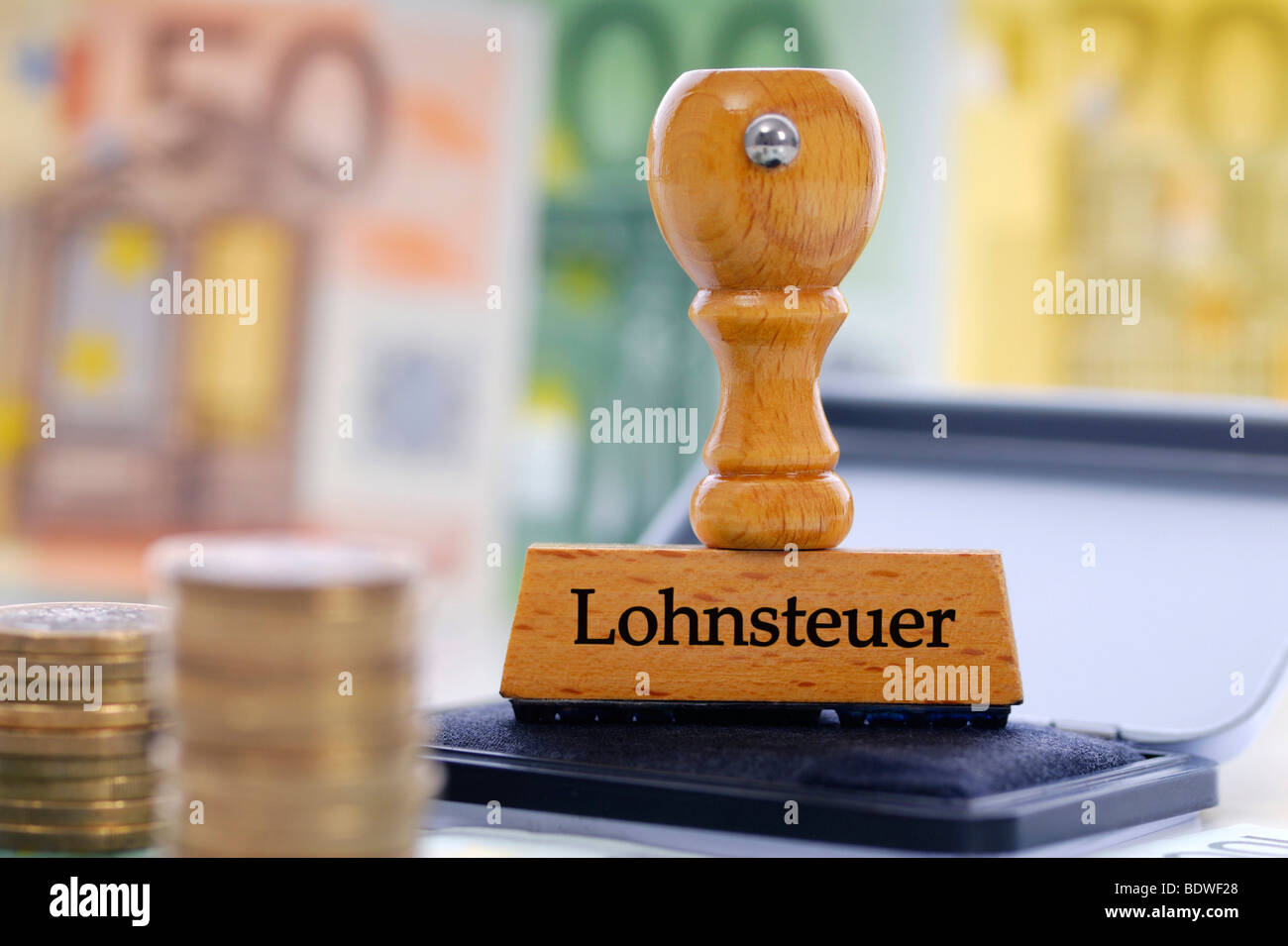 Stamp with the writing Lohnsteuer, German for income tax Stock Photo