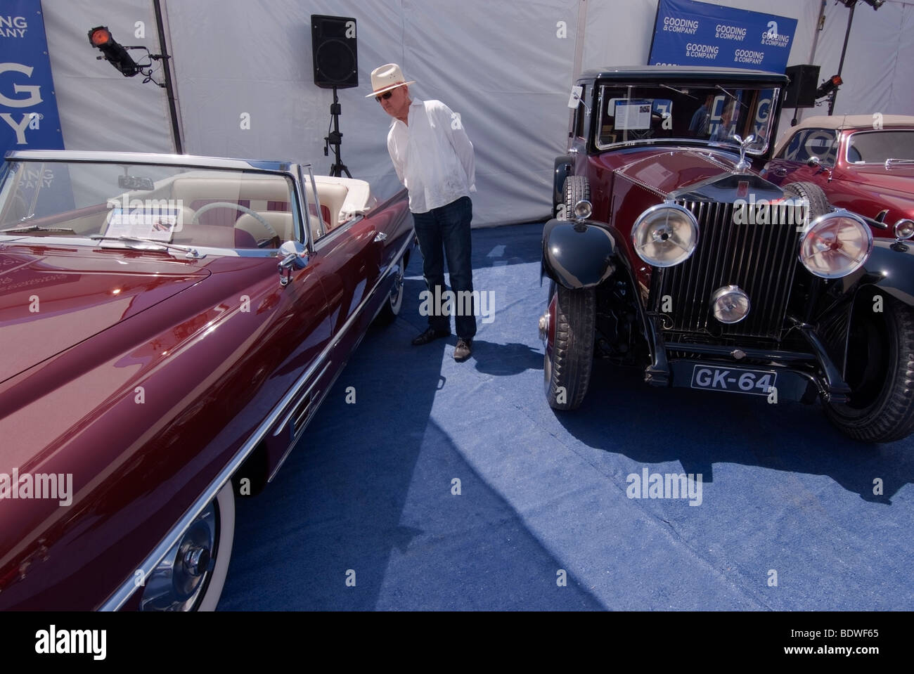 Bidder inspecting a 1957 Dual-Ghia outside one of the Gooding & Company tents at the Pebble Beach Concours d'Elegance Stock Photo