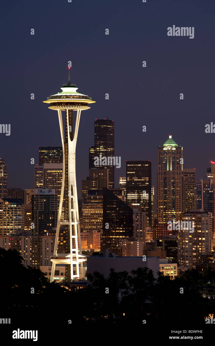 Retro image of Space Needle and downtown Seattle at night and city lights, Washington State Stock Photo