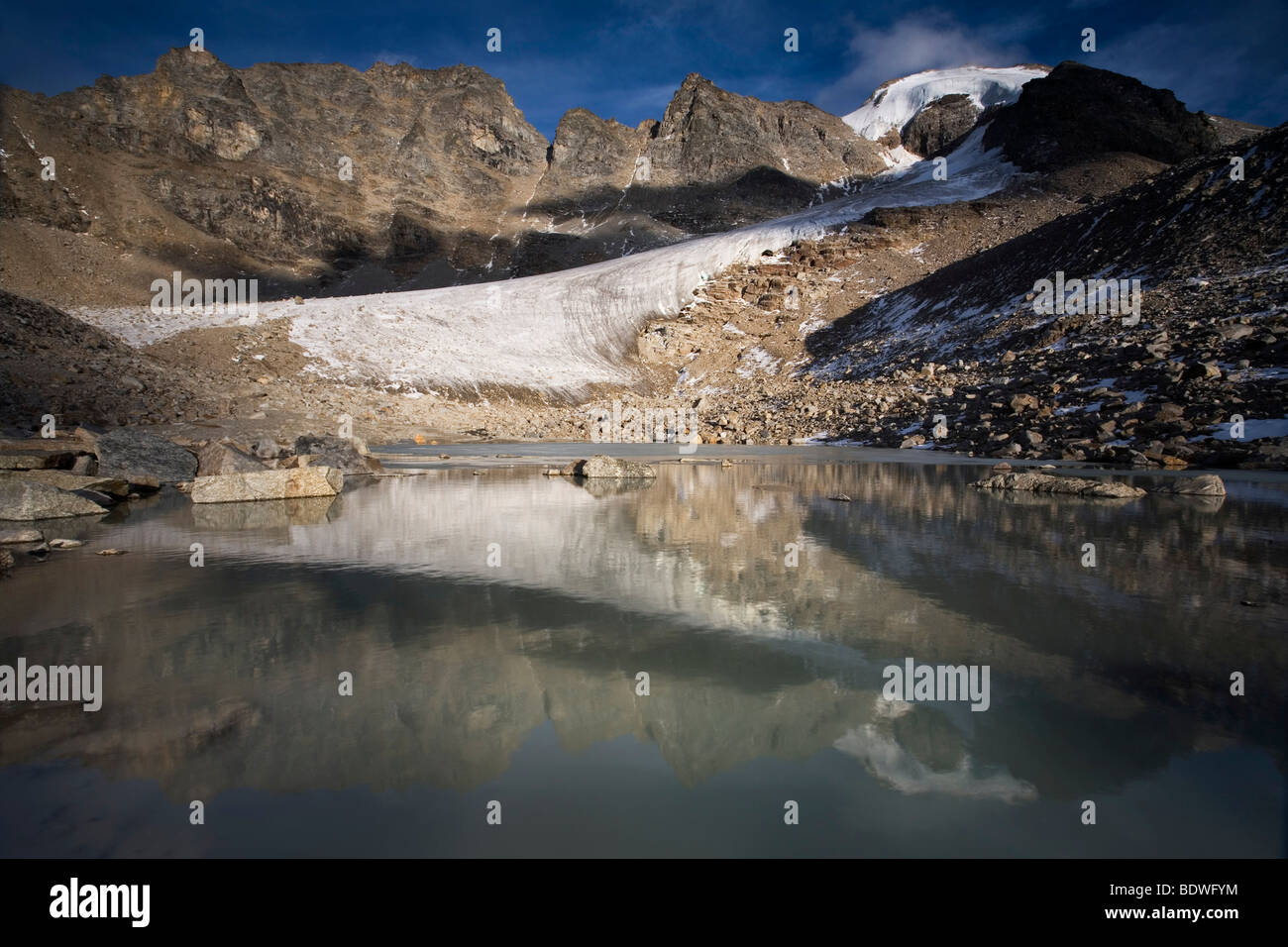Mt. L'Angelo Grande reflected in a glacial lake, Ortler mountain range, Stelvio National Park, South Tyrol, Italy, Europe Stock Photo