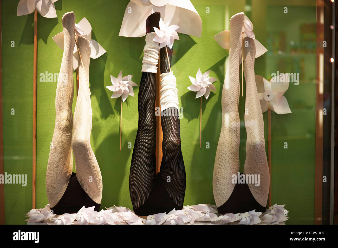 Window display, with wind wheels and legs of window dummies, advertising tights Stock Photo