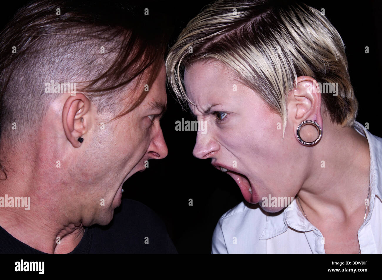 Couple screaming at each other Stock Photo